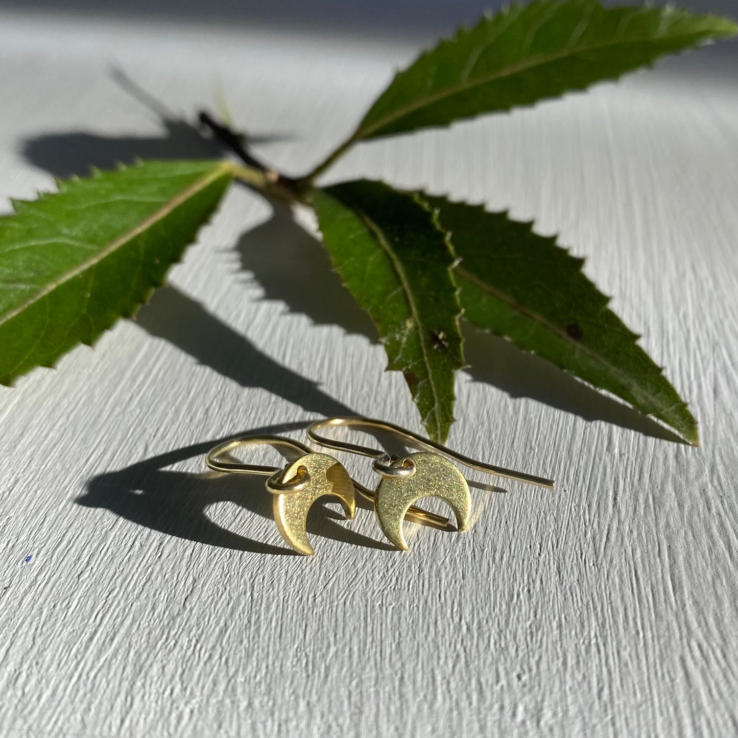 Tiny Moon Earrings in Brass