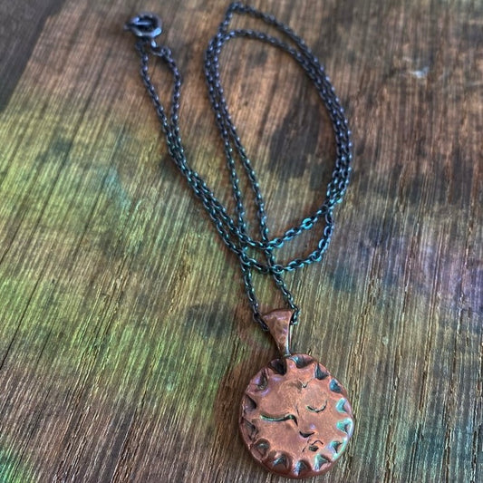 Copper Sun Pendant on Black Chain