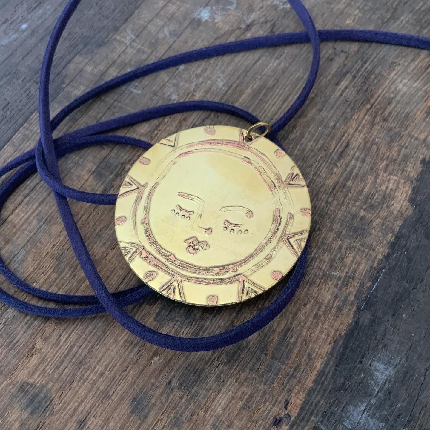 SISTER SUN 29 Brass pendant on blue cord