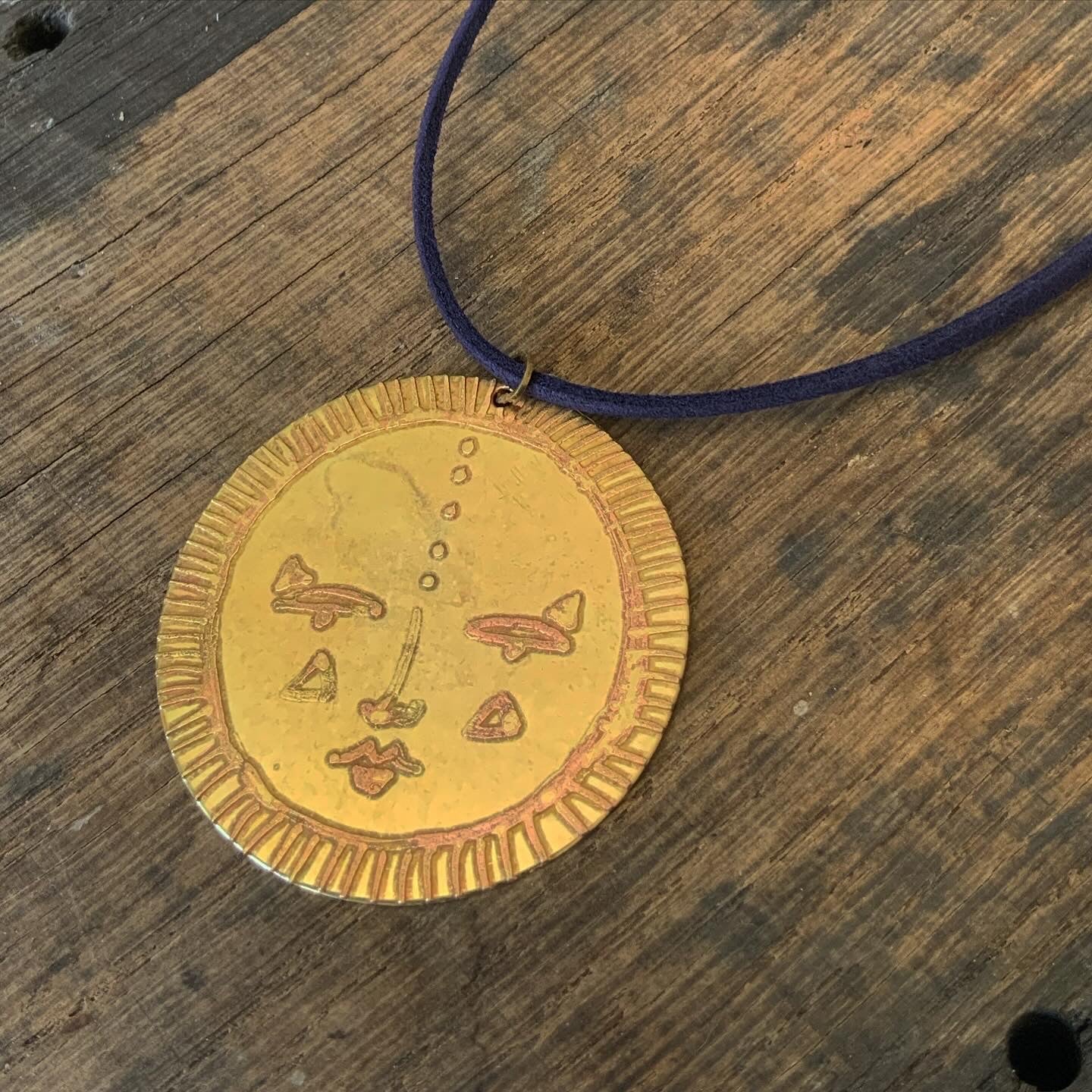 SISTER SUN 22 Brass pendant on blue cord