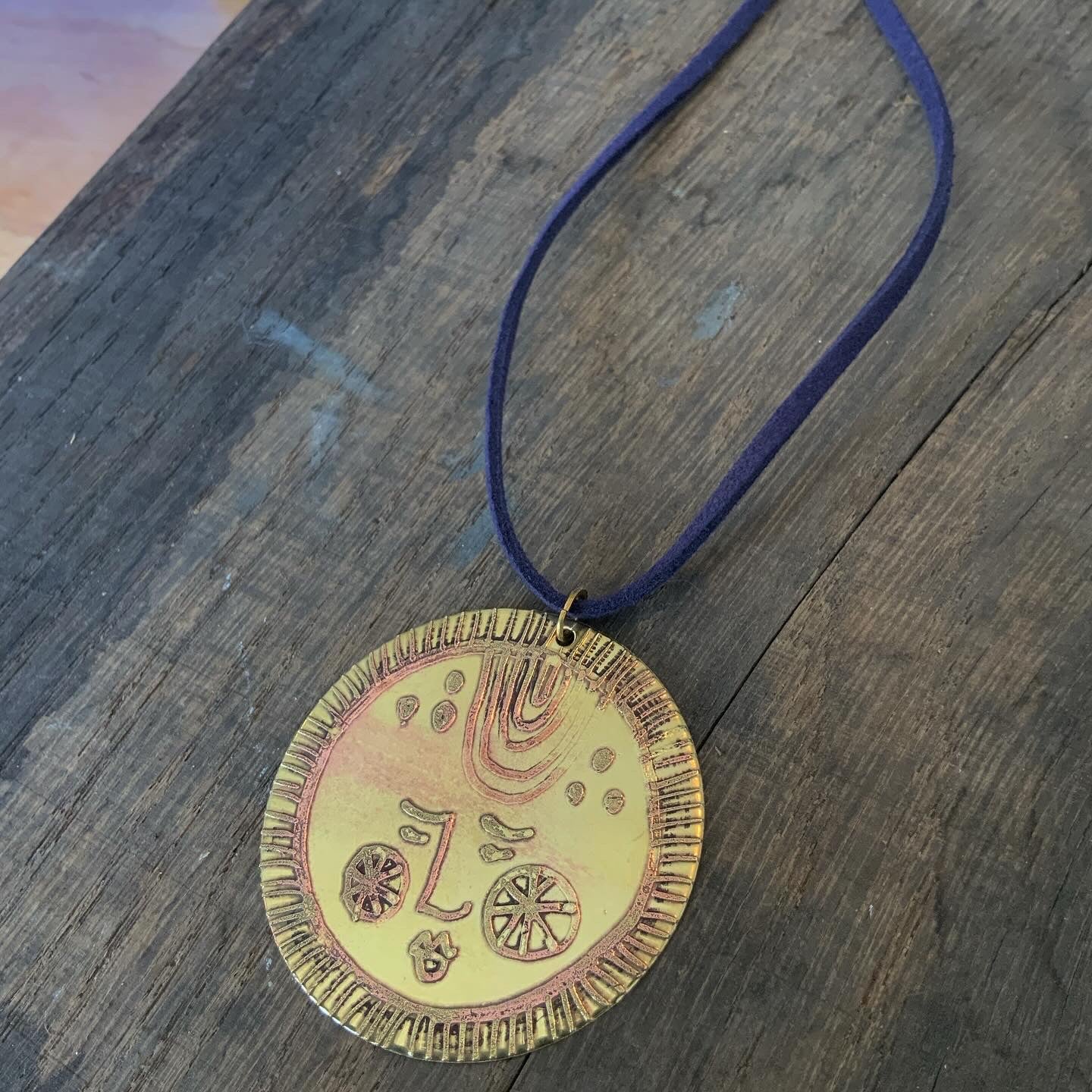 SISTER SUN 19 Brass pendant on blue cord