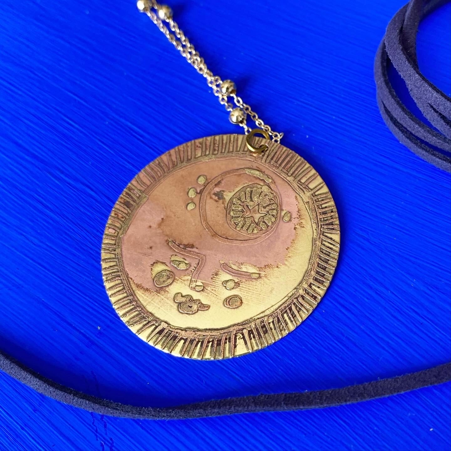 SISTER SUN 5 Brass pendant on blue cord