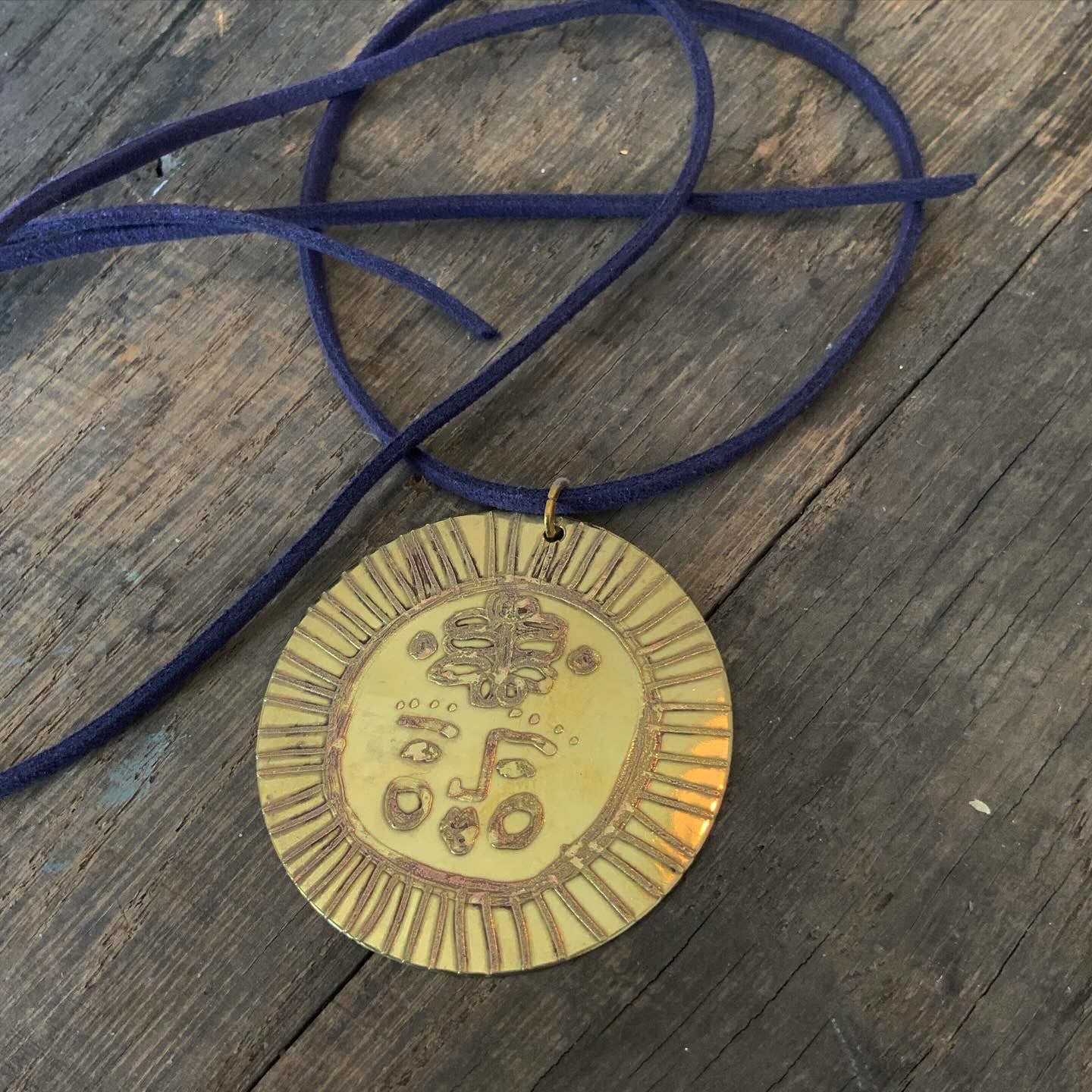 SISTER SUN 12 Brass pendant on blue cord