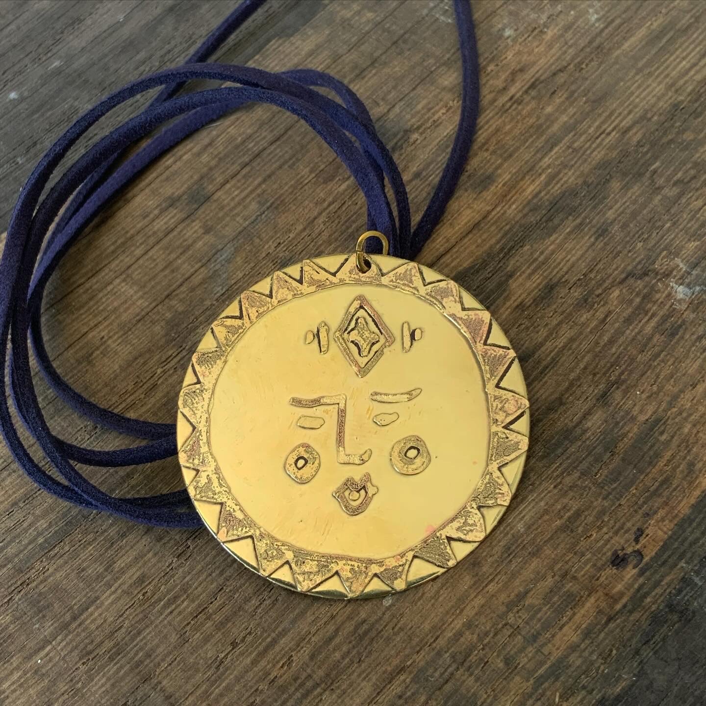 SISTER SUN 26 Brass pendant on blue cord