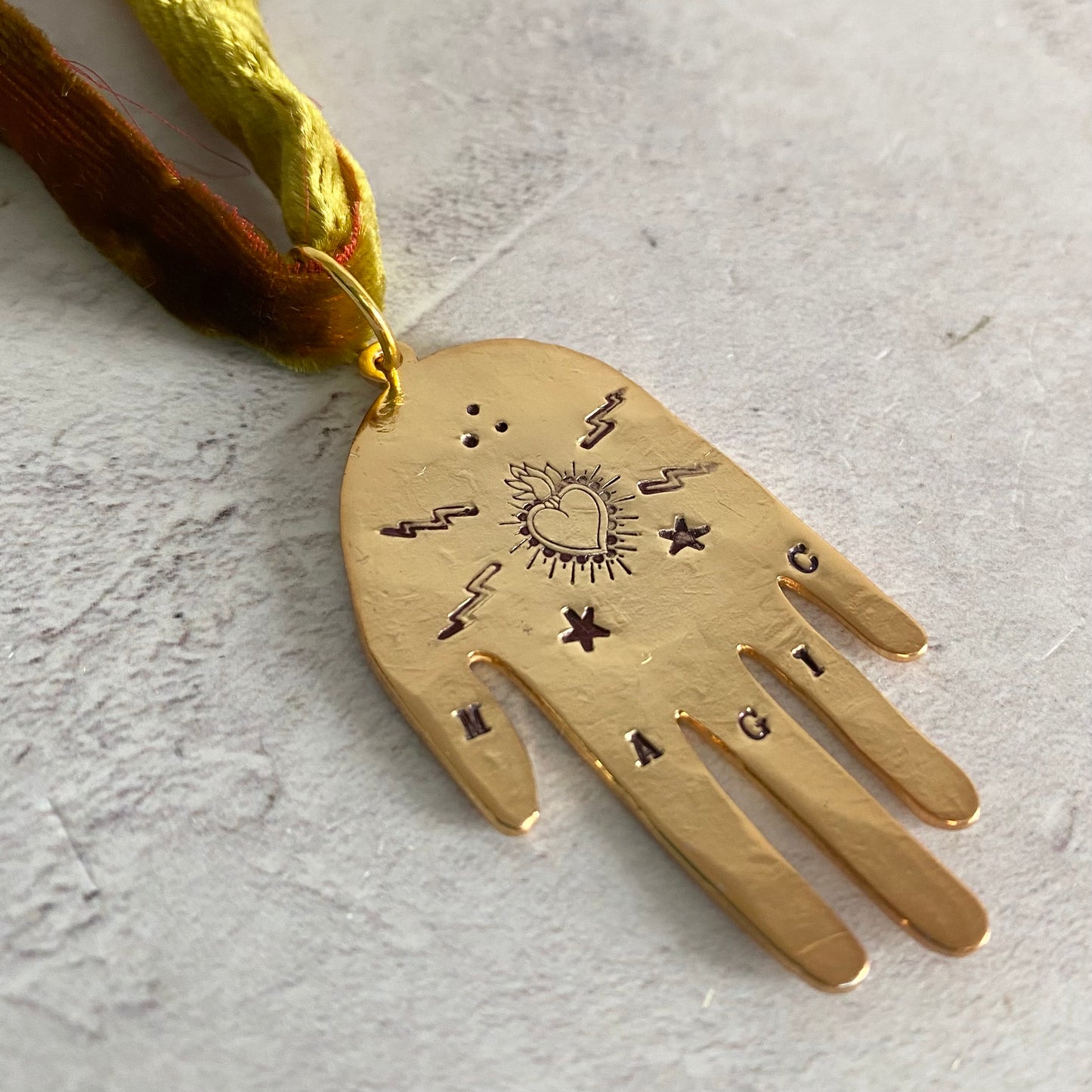 MAGIC Hand Pendant on Velvet