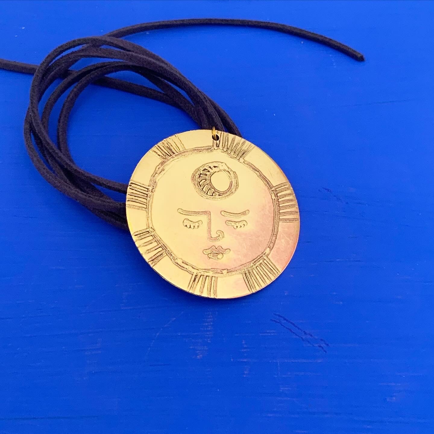 SISTER SUN 14 Brass pendant on blue cord