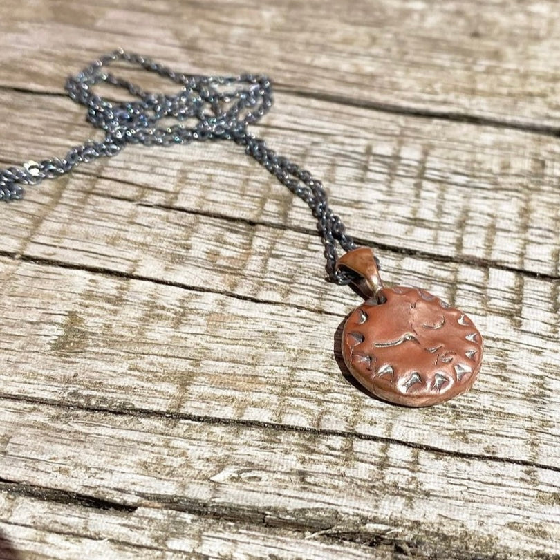 Copper Sun Pendant on Black Chain