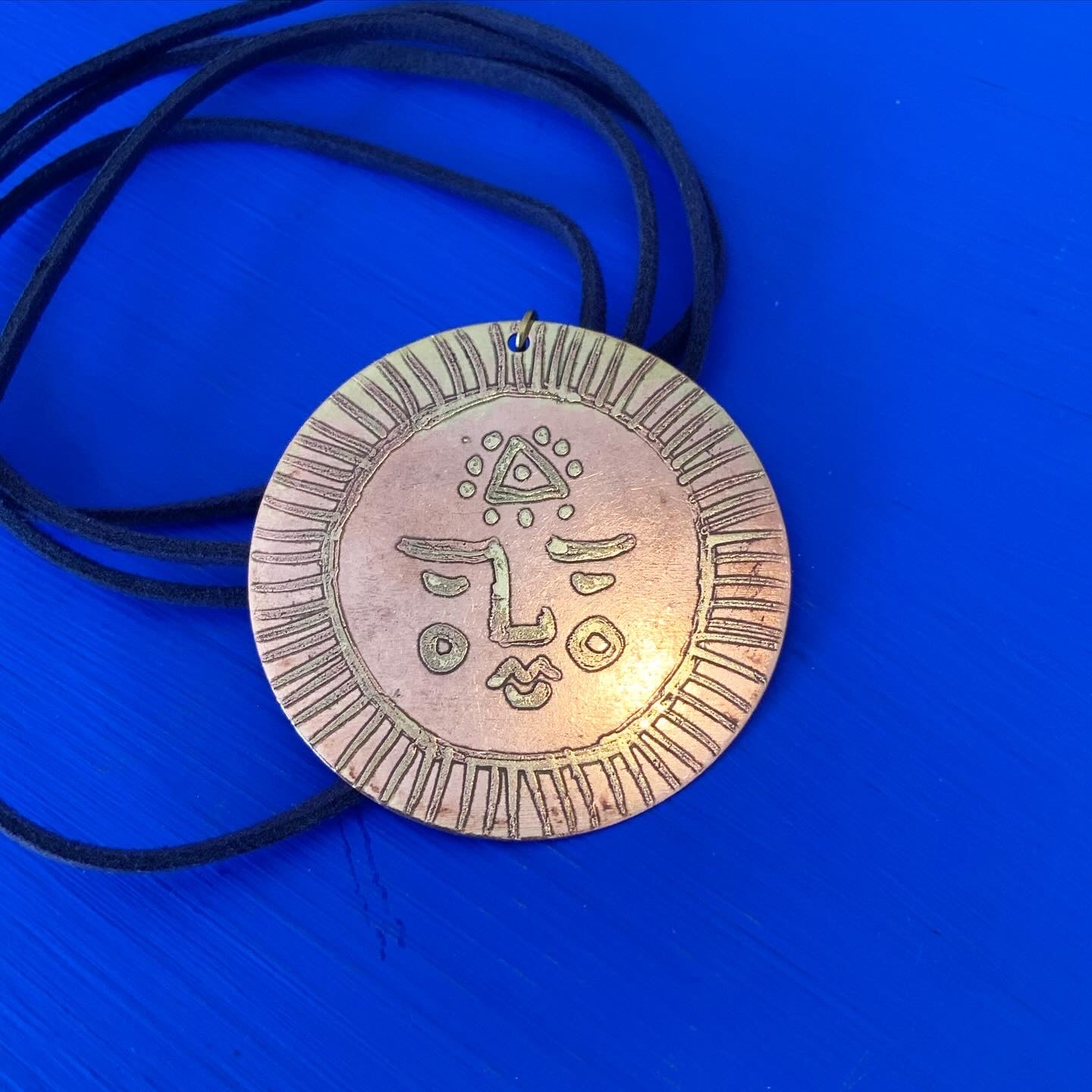 SISTER SUN 20 Brass pendant on blue cord