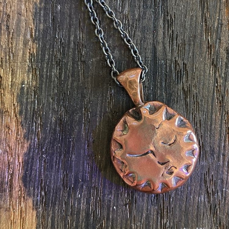 Copper Sun Pendant on Black Chain