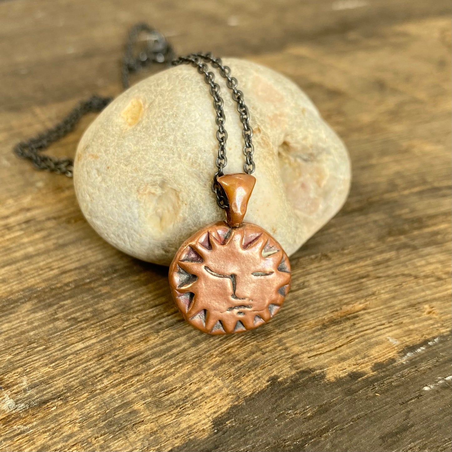 Copper Sun Pendant on Black Chain