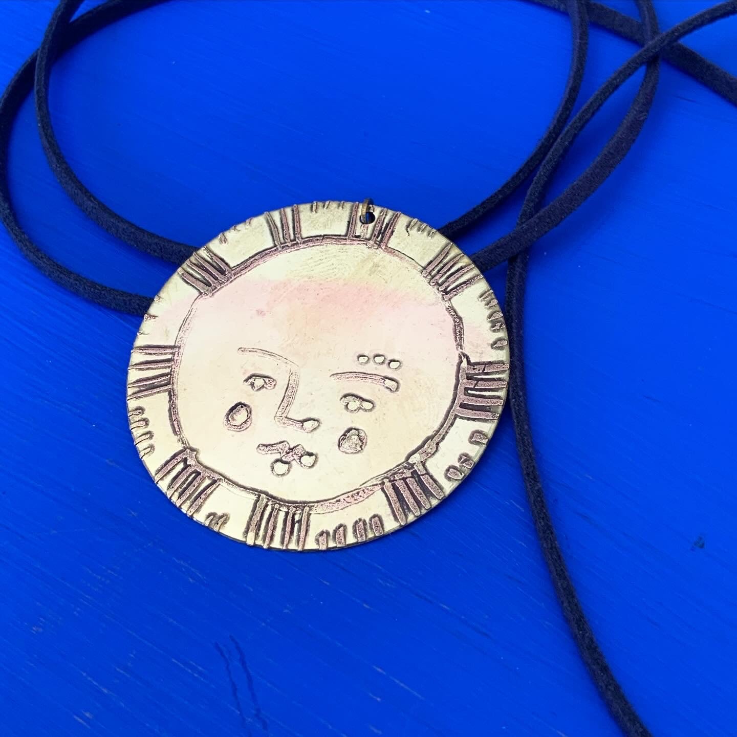 SISTER SUN 31 Brass pendant on blue cord