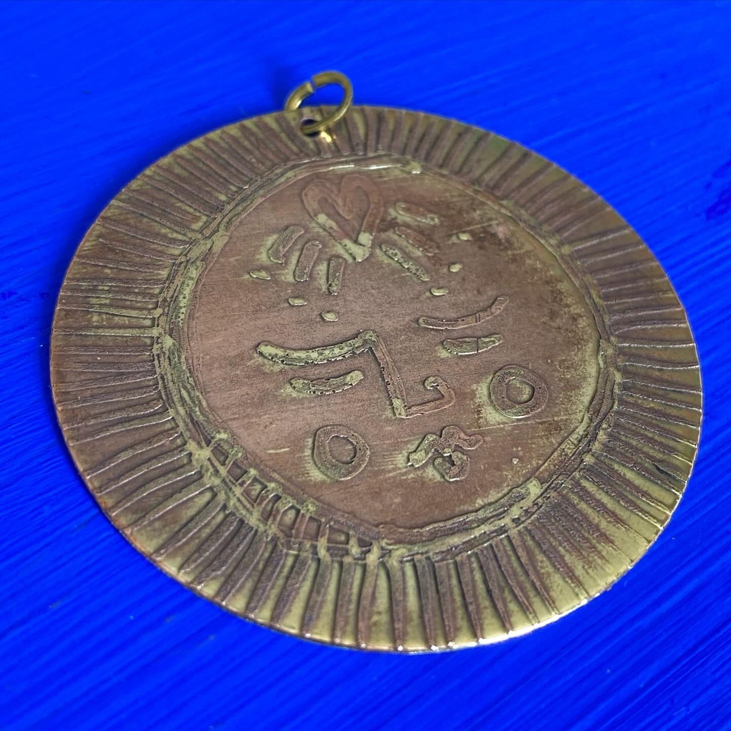 SISTER SUN 10 Brass pendant on blue cord